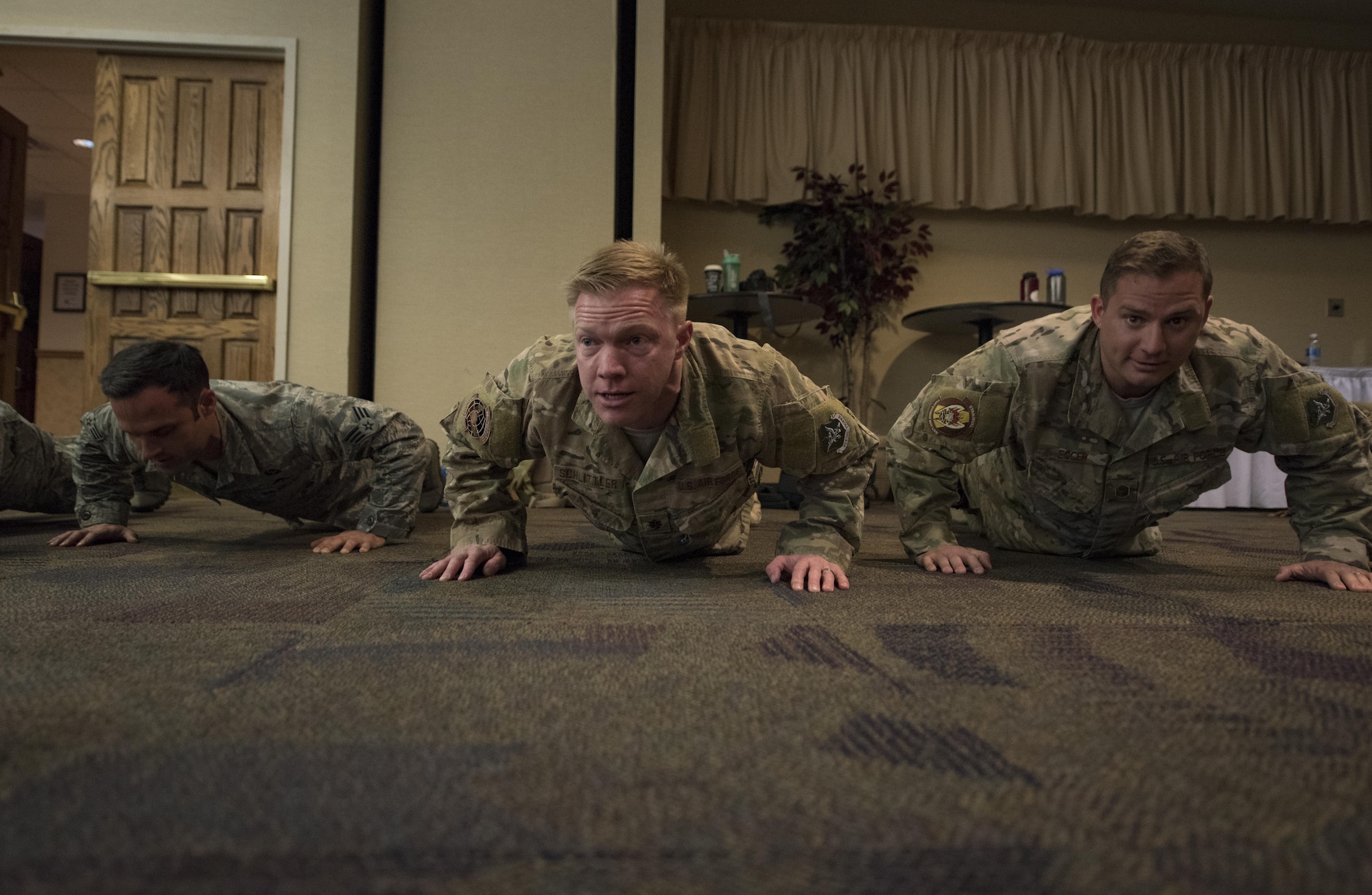 Airmen from the 38th Rescue Squadron perform ceremonial push-ups, March 3, 2017, at Moody Air Force Base, Ga. The push-ups were done in memory of Senior Airman Jason Cunningham and to honor retired Tech. Sgt. Keary Miller, for his brave actions during the battle of Roberts Ridge. (U.S. Air Force photo by Airman 1st Class Lauren M. Sprunk)