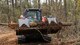 U.S. Air Force Staff Sgt. Thomas Adams, a civil engineer with the 116th Air Control Wing, Georgia Air National Guard, removes trees and debris with a Kubota while clearing a 20-foot wide, 1.5 mile trail through a five-acre area at Wellston Park, Warner Robins, Ga., March 5, 2017. The engineers partnered with the City of Warner Robins to assist in the completion of Wellston Park through the Innovative Readiness Training (IRT) program. The IRT program is a US military volunteer training opportunity that provides training and readiness for military personnel while addressing public and civil-society needs. (U.S. Air National Guard photo by Senior Master Sgt. Roger Parsons)