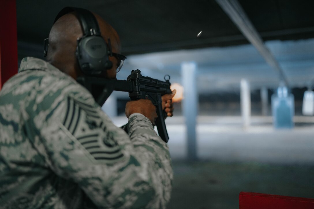 Chief Master Sgt. of the Air Force Kaleth O. Wright shoots an MP5 submachine gun at the firing range at Joint Base Andrews, Md., March 14, 2017. Wright’s visit afforded him the opportunity to learn from and interact with Airmen of the 11th Security Support Squadron. (U.S. Air Force photo by Senior Airman Delano Scott) 