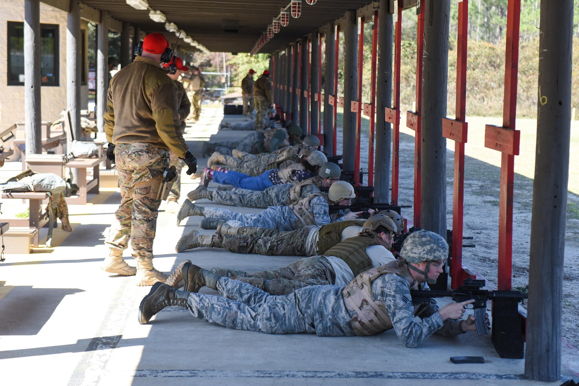 Combat Arms Training and Maintenance instructors with the 1st Special Operations Security Forces Squadron supervise Air Commandos as they fire their M4 rifles down range during a weapons qualification course at Hurlburt Field, Fla., March 16, 2017. Instructors watch the students’ techniques and performance take notes on how to help them improve firing techniques. (U.S. Air Force photo by Senior Airman Jeff Parkinson)