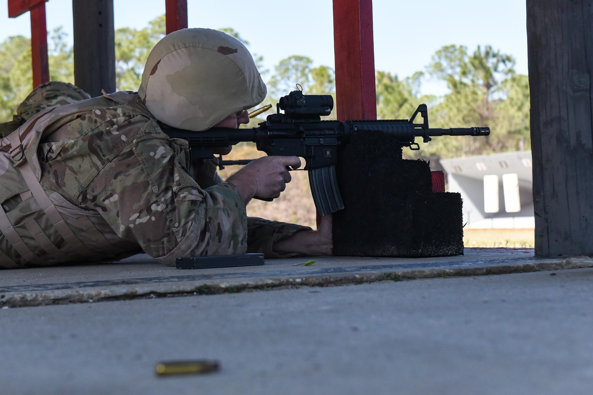 Master Sgt. Derek Zarnesky, flight chief with the 11th Special Operations Intelligence Squadron, fires his M4 rifle during a weapons qualification course at the Combat Arms Training and Maintenance range, Hurlburt Field, Fla., March 16, 2017. Air Commandos are required to qualify on the M9 pistol and M4 rifle prior to deploying to certain locations around the world. (U.S. Air Force photo by Senior Airman Jeff Parkinson)