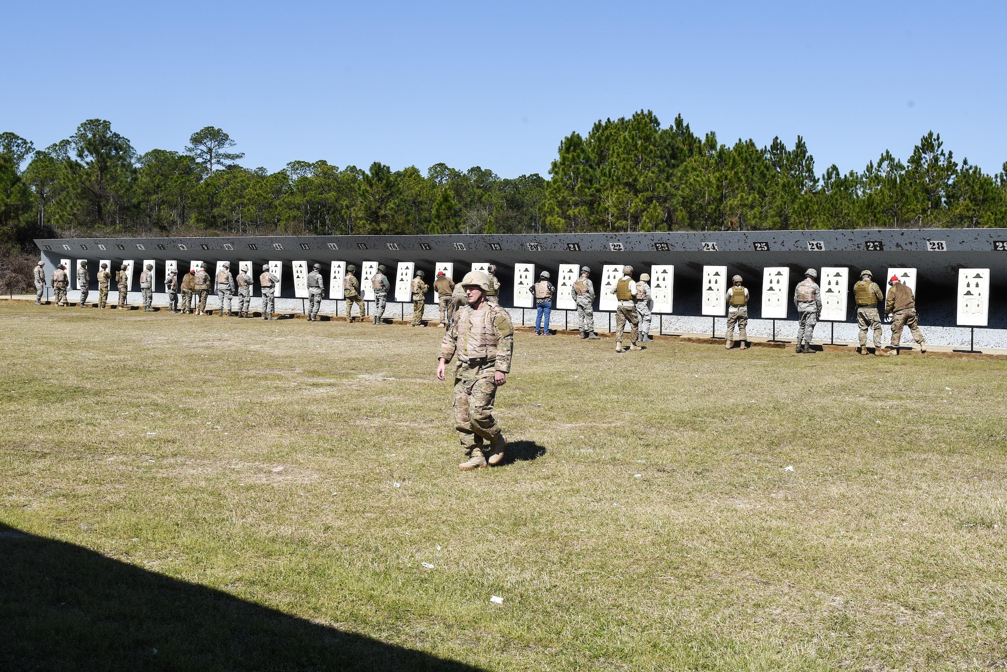 Air Commandos have their targets evaluated by Combat Arms Training and Maintenance instructors from the 1st Special Operations Security Forces Squadron during a weapons qualification course at Hurlburt Field, Fla., March 16, 2017. Hurlburt’s CATM range is the second busiest in the Air Force,  annually qualify approximately 11,000 students on the M9 pistol and M4 rifle. (U.S. Air Force photo by Senior Airman Jeff Parkinson)