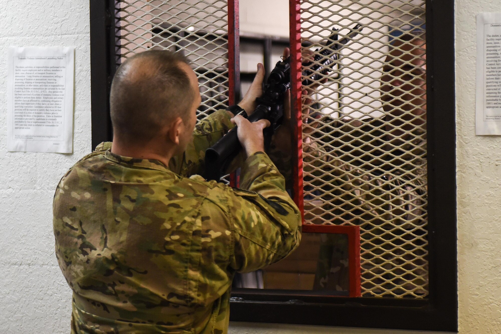 Master Sgt. Derek Zarnesky, flight chief with the 11th Special Operations Intelligence Squadron, is issued a M4 rifle during a weapons qualification course at the Combat Arms Training and Maintenance range, Hurlburt Field, Fla., March 16, 2017.  Air Commandos are required to qualify on the M9 pistol and M4 rifle prior to deploying to certain locations around the world.  (U.S. Air Force photo by Senior Airman Jeff Parkinson)