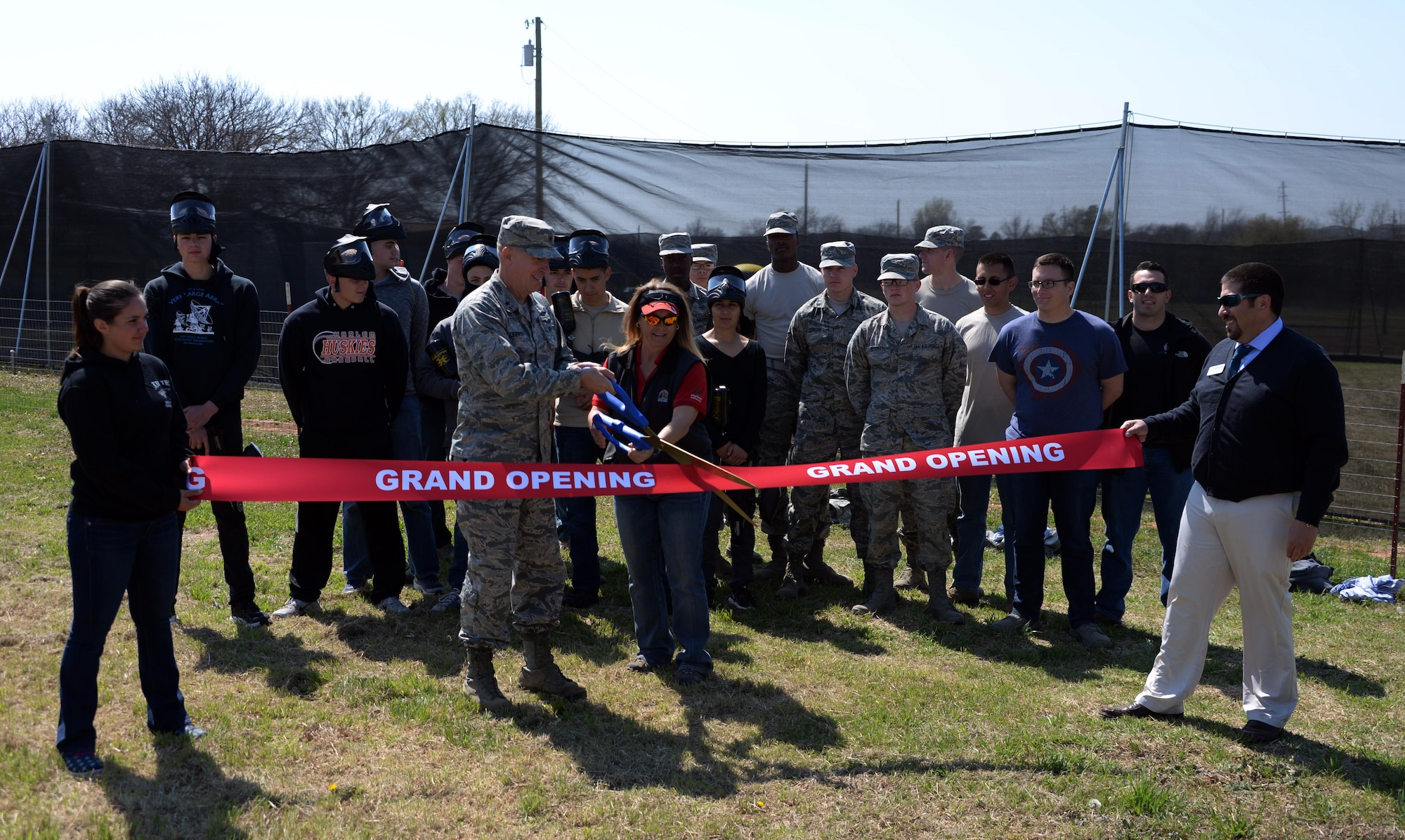 Brig. Gen. Patrick Doherty, 82nd Training Wing commander, along with Elizabeth Clements, Outdoor Recreation director, cut the ribbon during the grand opening of the paintball facility at Wind Creek Park on Sheppard Air Force Base, Texas, March 15, 2017. (U.S. Air Force photo by Senior Airman Robert L. McIlrath/Released)