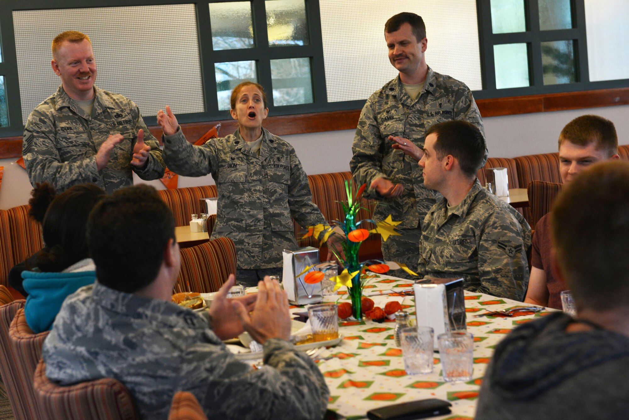 Leadership from the 20th Fighter Wing sing “Happy Birthday” to Airmen during a birthday dinner at Shaw Air Force Base, S.C., March 15, 2017. Monthly birthday dinners are an opportunity for Airmen to network with others and for their leadership to mentor them. (U.S. Air Force photo by Airman 1st Class Destinee Sweeney)