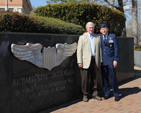 Retired Lt. Col. Richard "Gene" Smith, former Vietnam POW, poses for a photo with retired Maj. Gen Jack Catton, former 14th Flying Training Wing Commander March 14, 2014, at the Memorial Wall on Columbus Air Force Base, Mississippi. March 14 marked the 44th anniversary of Smith's repatriation.
