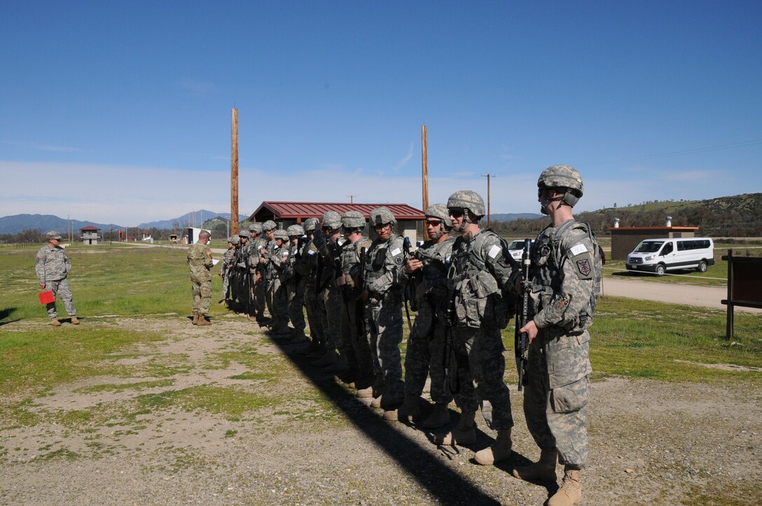 FORT HUNTER LIGGETT, Calif. - The 200th Military Police Command conducted their Best Warrior Competitions at Fort Hunter Liggett in March 2017. Soldiers line up after the M9 weapons qualifications for their scores. (US Army Reserve photo by Amy Phillips/Released)