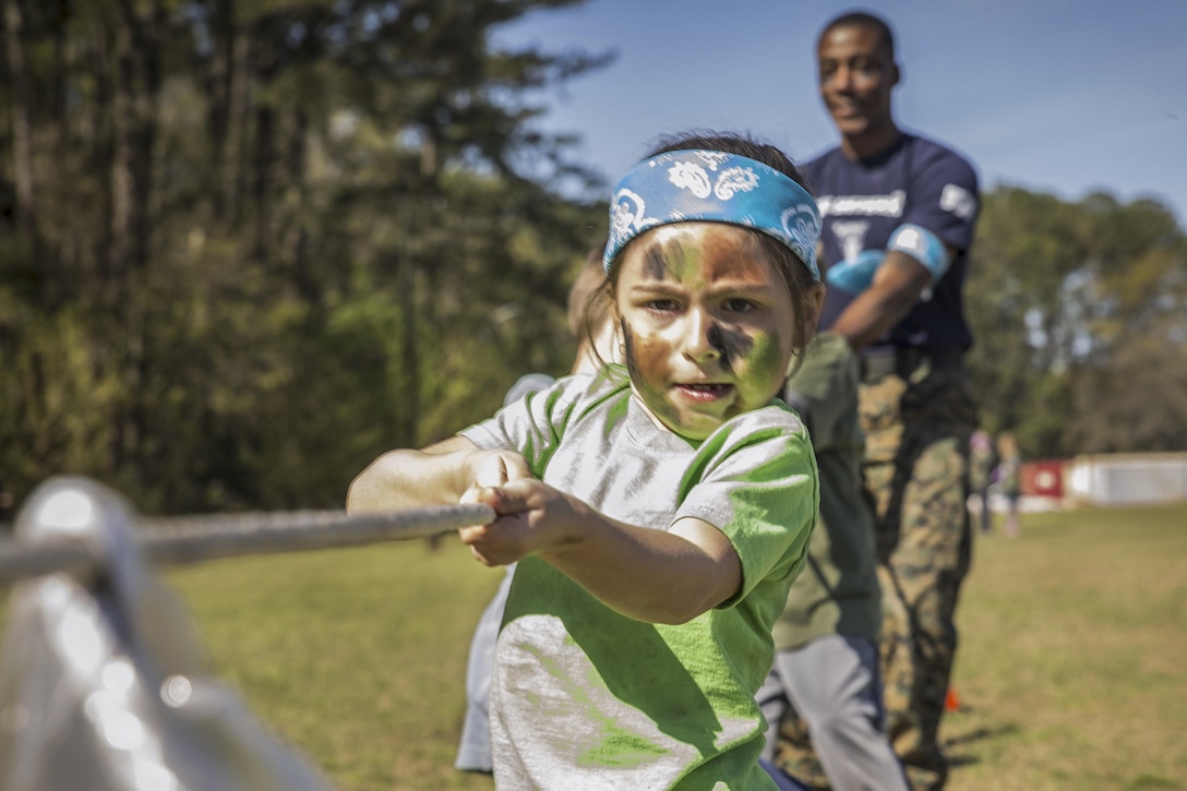 A child participates in tug of war during a "Mini Marines" event for military children at Marine Corps Air Station Beaufort, S.C., March 11, 2017. Marine Corps photo by Lance Cpl. Ashley Phillips