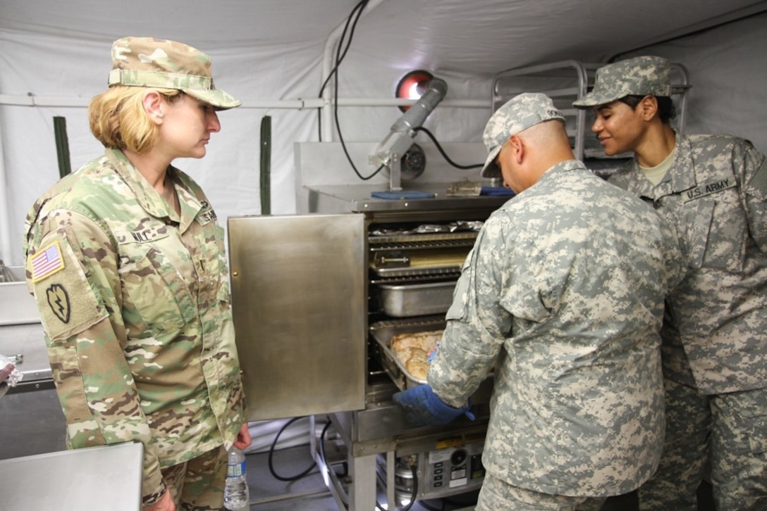 United States Army Reserve Command CW5 Pamela Null evaluates the 49th Multifunctional Medical Battalion Food Service Team during the 2017 Philip A. Connelly Competition in Puerto Nuevo, Puerto Rico.