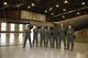A group of seven Mobility Guardian planners stand in front of a C-17 Globemaster III in a McChord Field hangar at Joint Base Lewis-McChord, Wash., March 15, 2017. The group coordinated an airspace plan for Air Mobility Command’s Mobility Guardian exercise that will take place here at JBLM this summer. (U.S. Air Force/Staff Sgt. Naomi Shipley)