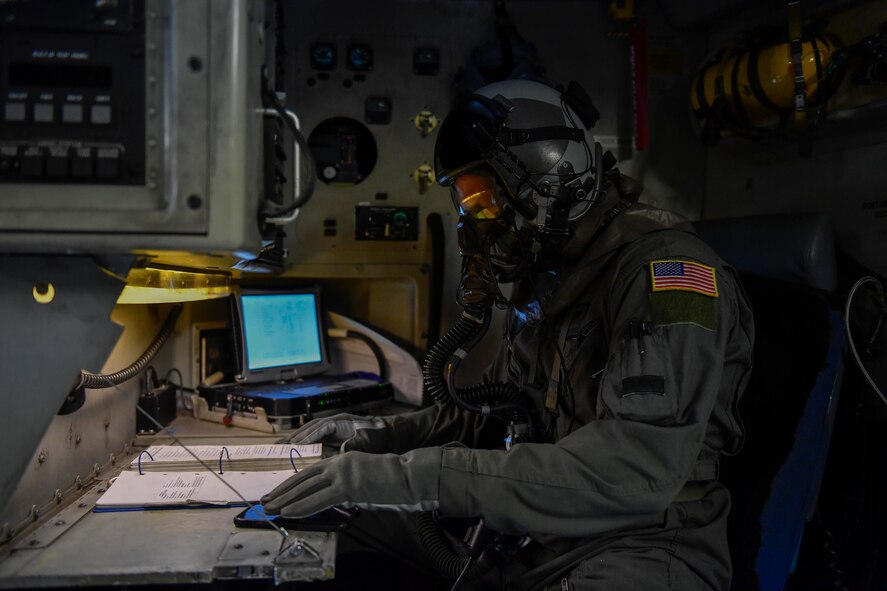 Senior Airman Grant Smart, 15th Airlift Squadron loadmaster, performs preflight checks before a flight to North Auxiliary Airfield in North, South Carolina, March 15, 2017 to execute in-flight training with aircrew eye and respiratory protection system (AERPS) equipment. The flight marked the first time in more than 10 years where aircrews wore AERPS equipment. AERPS equipment consists of a rubber mask, multiple layers of boots and gloves, fan filter system and an audio and speaker system.