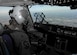 Capt. Jason Carroll, 15th Airlift Squadron airdrop instructor pilot, flies to North Auxiliary Airfield in North, South Carolina, March 15, 2017 to execute in-flight training with aircrew eye and respiratory protection system (AERPS) equipment. The flight marked the first time in more than 10 years where aircrews wore AERPS equipment. AERPS equipment consists of a rubber mask, multiple layers of boots and gloves, fan filter system and an audio and speaker system.