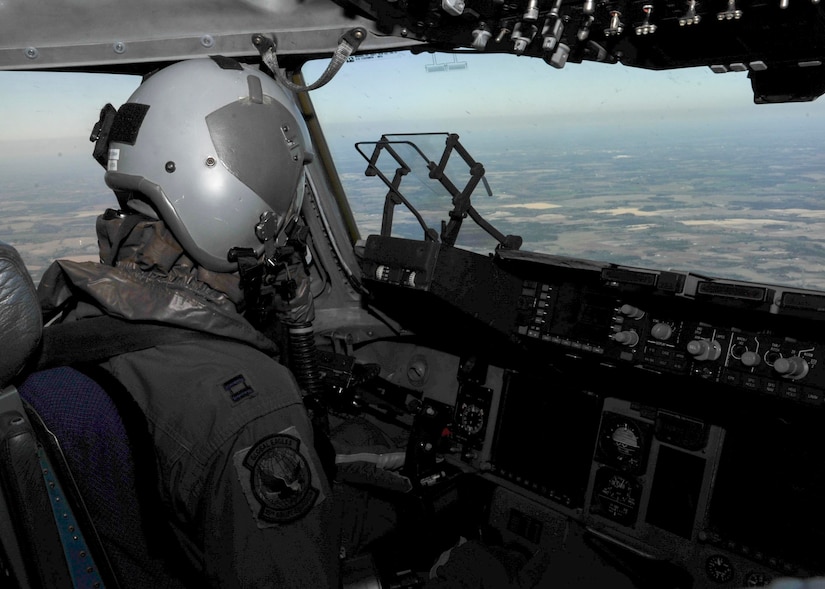 Capt. Jason Carroll, 15th Airlift Squadron airdrop instructor pilot, flies to North Auxiliary Airfield in North, South Carolina, March 15, 2017 to execute in-flight training with aircrew eye and respiratory protection system (AERPS) equipment. The flight marked the first time in more than 10 years where aircrews wore AERPS equipment. AERPS equipment consists of a rubber mask, multiple layers of boots and gloves, fan filter system and an audio and speaker system.