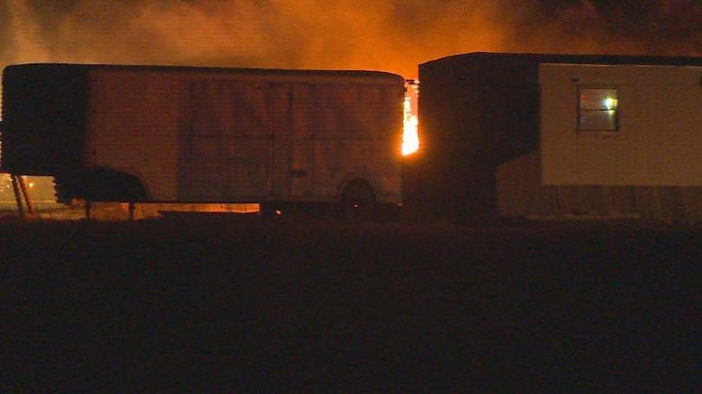 Flames rise behind a mobile home during an overnight fire approximately 3 miles from Schriever Air Force Base, Colorado, Monday, March 13, 2017. Schriever Fire Department personnel responded in a matter of minutes, quarantining the fire and combating the flames, eventually extinguishing the blaze after several hours. (Photo courtesy/KKTV)