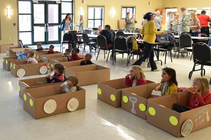 Members of Joint Base Charleston watch a movie as part of the Airman and Family Readiness Center’s Hearts Apart, Dinner at the Drive-in 2 event at the JB Charleston Chapel Annex March 14, 2017. The event gave kids the opportunity to design their own cars out of arts and craft supplies with the help of volunteers from Airman Leadership School class 17-C Bravo Flight. The cars were used by the children to watch a movie in a drive-in atmosphere.