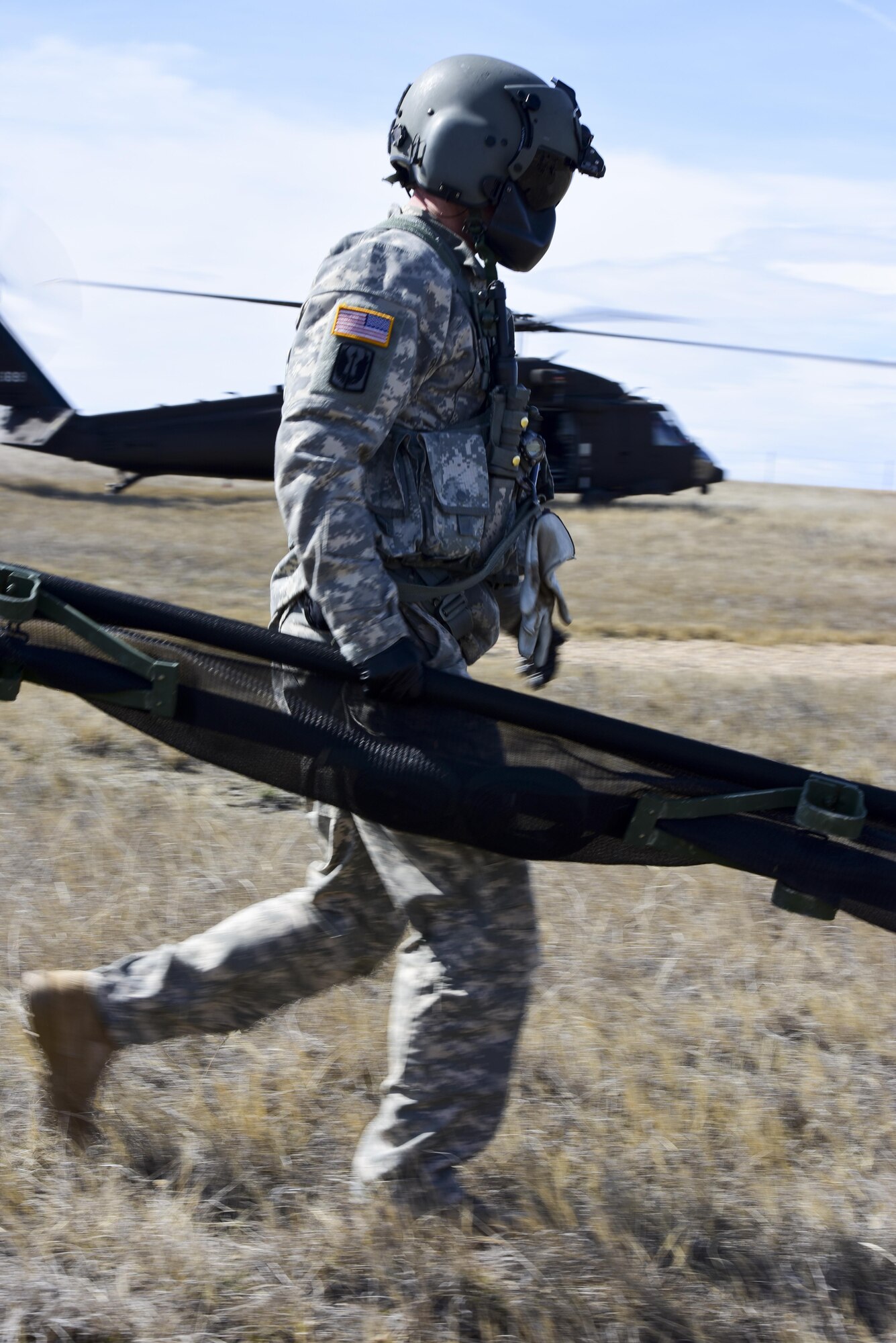A U.S. Soldier with the South Dakota National Guard moves a portable litter during exercise Combat Raider at the Powder River Training Complex, March 15, 2017. Medical technicians with the SDNG participated in the exercise by providing a medical evacuation for Airmen acting as downed pilots. (U.S. Air Force photo by Airman 1st Class Randahl J. Jenson)