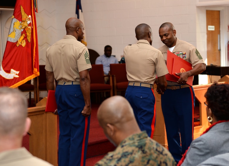 Sgt. Maj. Kenneth V. Agee, former sergeant major, Marine Corps Logistics Base Albany, receives several certificates during a retirement ceremony at the Chapel of the Good Shepherd, here, March 16.