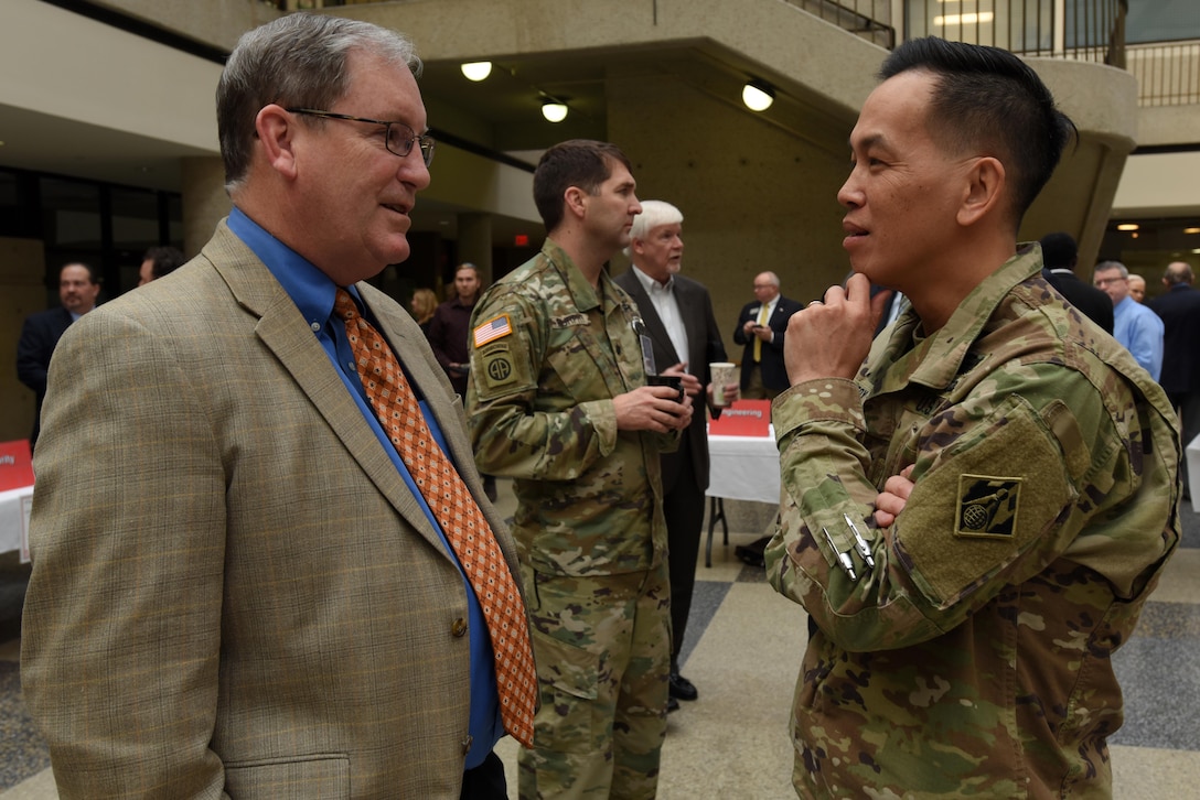 Brig. Gen. Mark Toy, U.S. Army Corps of Engineers Great Lakes and Ohio River Division commander, talks with Mike Wilson, Nashville District deputy for Programs and Project Management, during the First Annual Nashville District Small Business Opportunities Open House at Tennessee State University in Nashville, Tenn., March 16, 2017. The event gave business leaders direct access to Nashville District officials from across the organization.