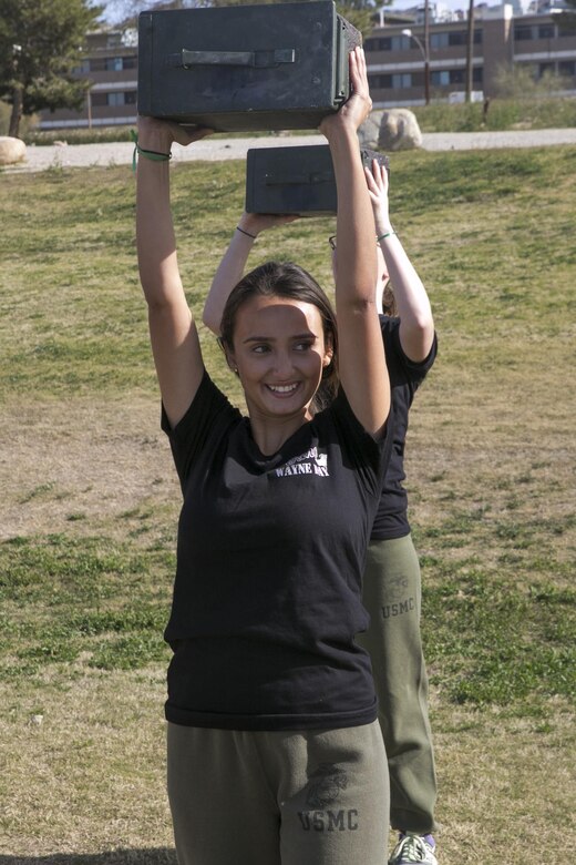 The wife of a Marine with 3rd Battalion, 4th Marines, 7th Marine Regiment, performs an ammunition can lift during a modified Combat Fitness Test at Del Valle Field during the battalion’s Jane Wayne aboard Marine Corps Air Ground Combat Center, Twentynine Palms, Calif., March 8, 2017. (U.S. Marine Corps photo by Cpl. Julio McGraw)