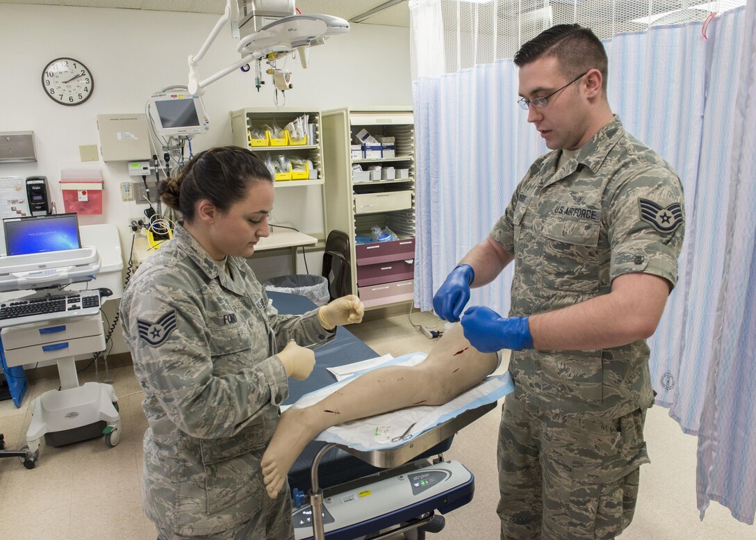 Staff Sgts. Heather Ford (left) and Joshua Woods, 366th Medical Operations Squadron aerospace medical technicians, complete a medical training scenario March 16, 2017, at Mountain Home Air Force Base, Idaho. Everyone in health care plays a role in safe care of patients from medical technicians to doctors. (U.S. Air Force photo by Airman Jeremy D. Wolff/Released)