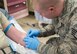 Staff Sgt. Lucas Robbins, 366th Medical Group paramedic, inserts an IV into an airman's arm March 16, 2017, at Mountain Home Air Force Base, Idaho. Patient safety week was Mar 12-18, and has been a national campaign since 2002. (U.S. Air Force photo by Airman Jeremy D. Wolff/Released)