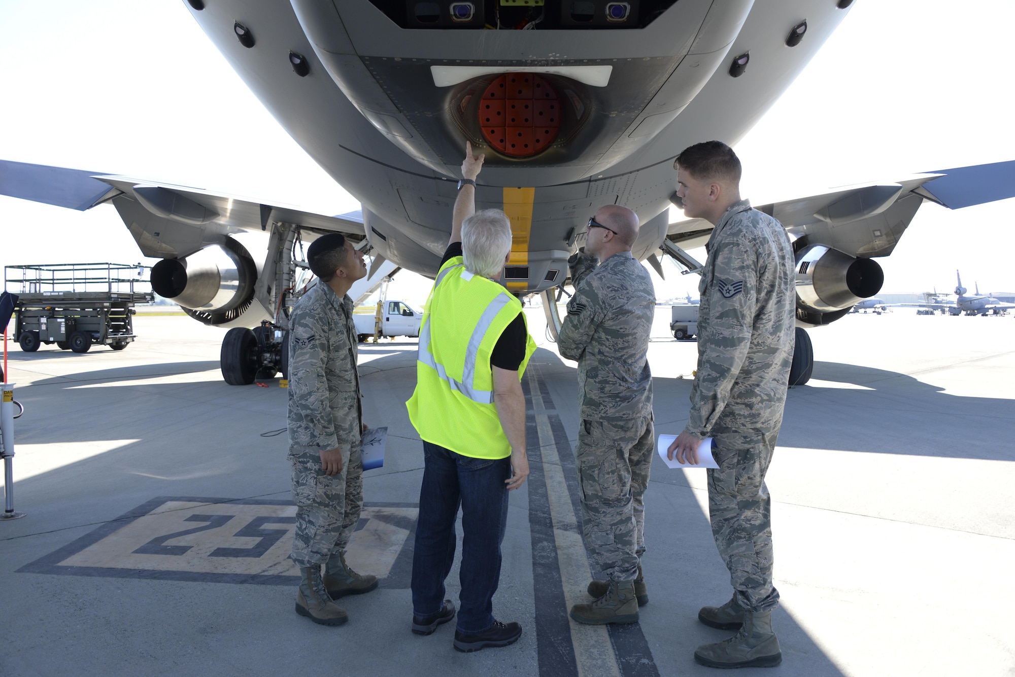 Steve Bentley, second from the right, a Boeing quality assurance lead, shows 60th Air Mobility Wing Airmen the KC-46A Pegasus March 8, 2017, at Travis Air Force Base, Calif. Travis was selected in January as a preferred location for the Air Force's newest refueling aircraft. (U.S. Air Force photo by Senior Airman Amber Carter) 