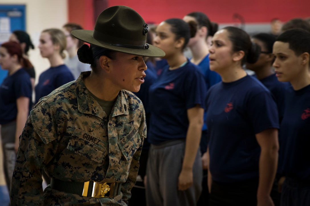 Staff Sgt. Grace Gomez, drill instructor for November Co., 4th Recruit Training Battalion, Marine Corps Recruit Depot Parris Island, South Carolina, speaks to female poolees during the Recruiting Station Portsmouth's Female Pool Function at Hanscom Air Force Base, March 4, 2017. The purpose of the event was to screen the poolees, conduct an Initial Strength Test and give them a period of instruction with a drill instructor prior to them leaving for recruit training.