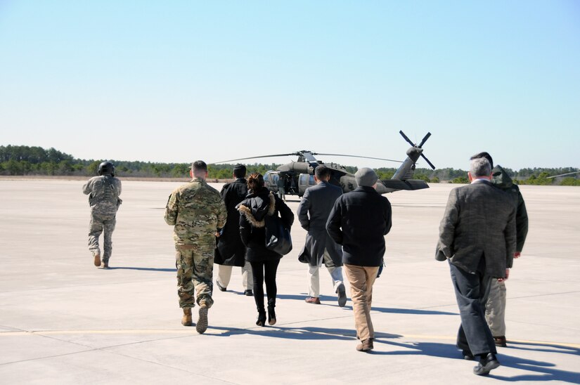 Congressional staff members prepare to board a UH-60 Blackhawk March 17 for an aerial tour of Joint Base McGuire-Dix-Lakehurst, New Jersey.  The day was designed to show the various ranges and training sites of the joint base. Joint Base McGuire-Dix-Lakehurst is home to more than 80 mission partners who provide a wide range of combat capability.