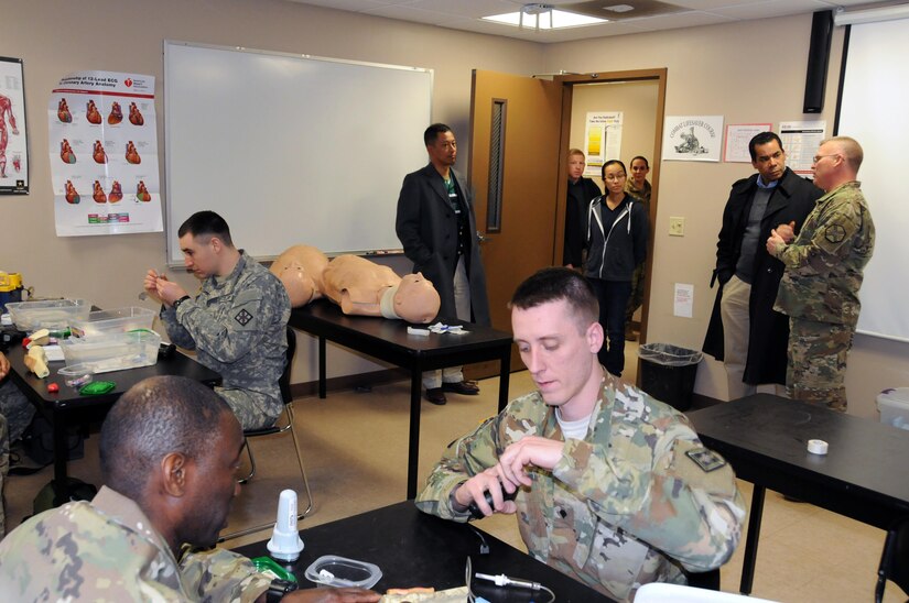 Sgt. 1st Class David Lovett (right), course coordinator at the Army Reserve's Medical Skills Training Center at Joint Base McGuire-Dix-Lakehurst, New Jersey, shows congressional staff members a training class March 17.  The day was designed to show the various ranges and training sites of the joint base. Joint Base McGuire-Dix-Lakehurst is home to more than 80 mission partners who provide a wide range of combat capability.