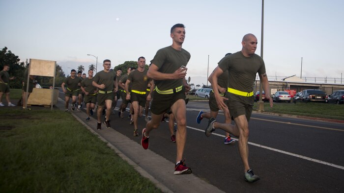 Marines with Headquarters Battalion begin a 3-mile run during their Physical Fitness Test at Marine Corps Base Hawaii, March 14, 2017. The PFT is an evaluation conducted throughout the Marine Corps annually to assess the level of fitness. For more information on the PFT updates, utilize Marine Corps Bulletin 6100.