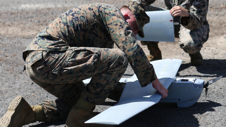 Lance Cpl. Nicholas Powell and Sgt. Chris Gyurgyik, both with 1st Battalion, 12th Marine Regiment, set up an Unmanned Aerial System at Marine Corps Training Area Bellows, March 8, 2017. The UAS is mainly used for aerial reconnaissance and can also be used for observation, local security, targeting, and prosecuting.