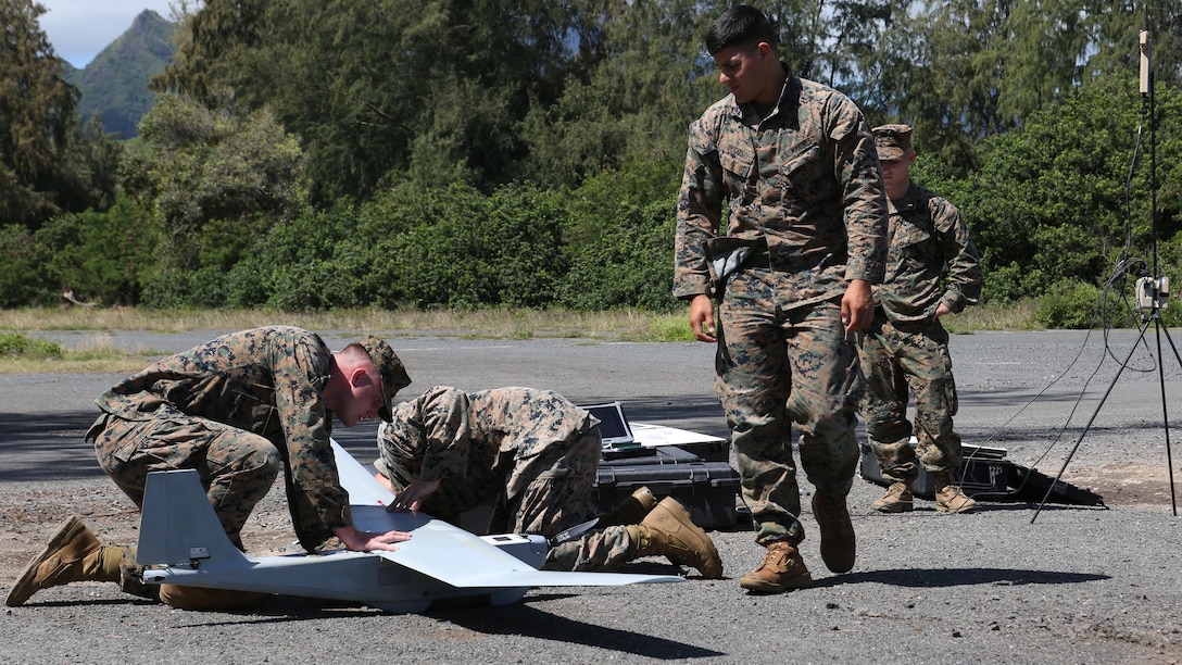 Cpl. Martin Decos observes the Unmanned Aerial System before take-off at Marine Corps Training Area Bellows, March 8, 2017. The UAS is mainly used for aerial reconnaissance and can also be used for observation, local security, targeting, and prosecuting. 