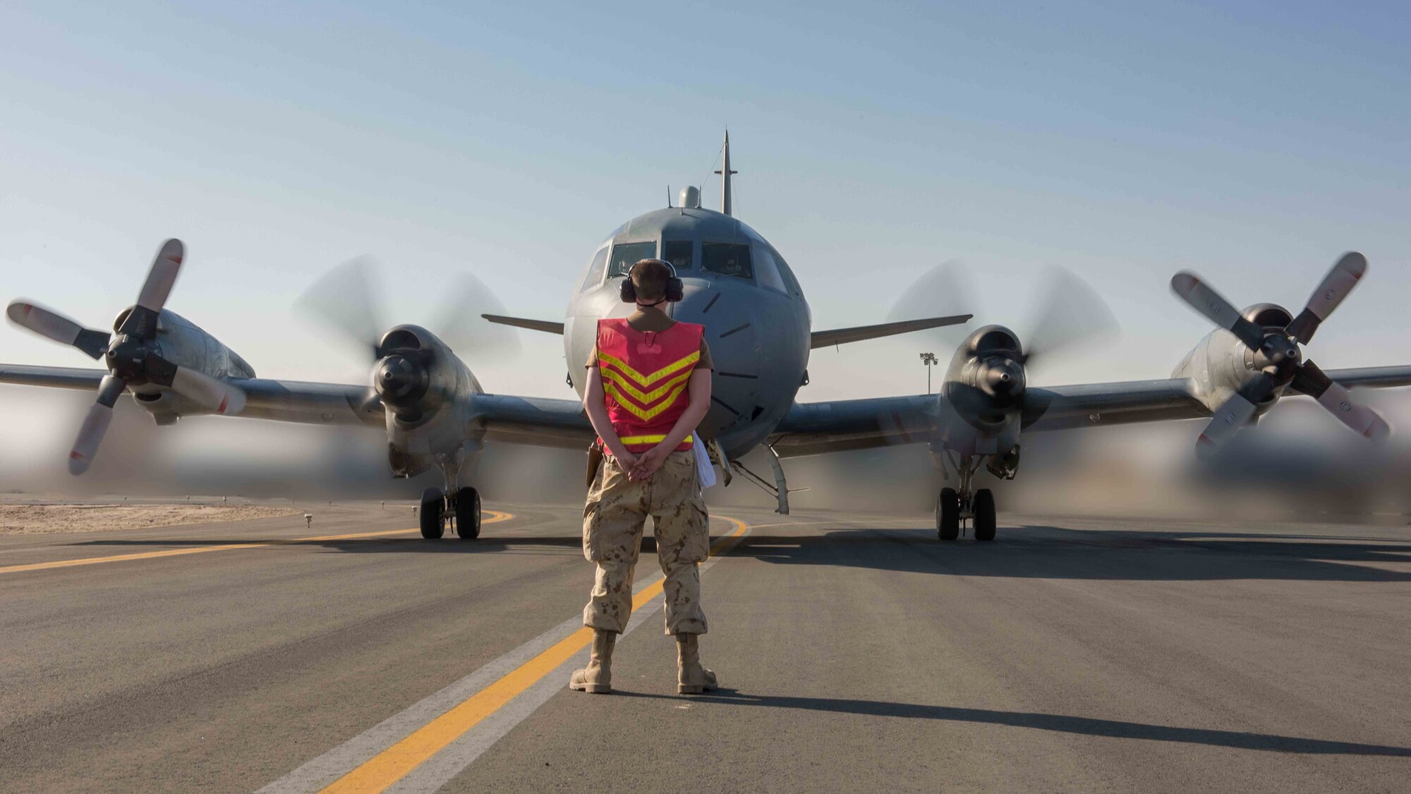 A CP-140 M Aurora taxis to a parking spot at an undisclosed location in Southwest Asia, following the successful completion of the Operation IMPACT Long Range Patrol Detachment’s 700th mission on February 28, 2017. (Courtesy photo illustration/Corporal PJ Letourneau)