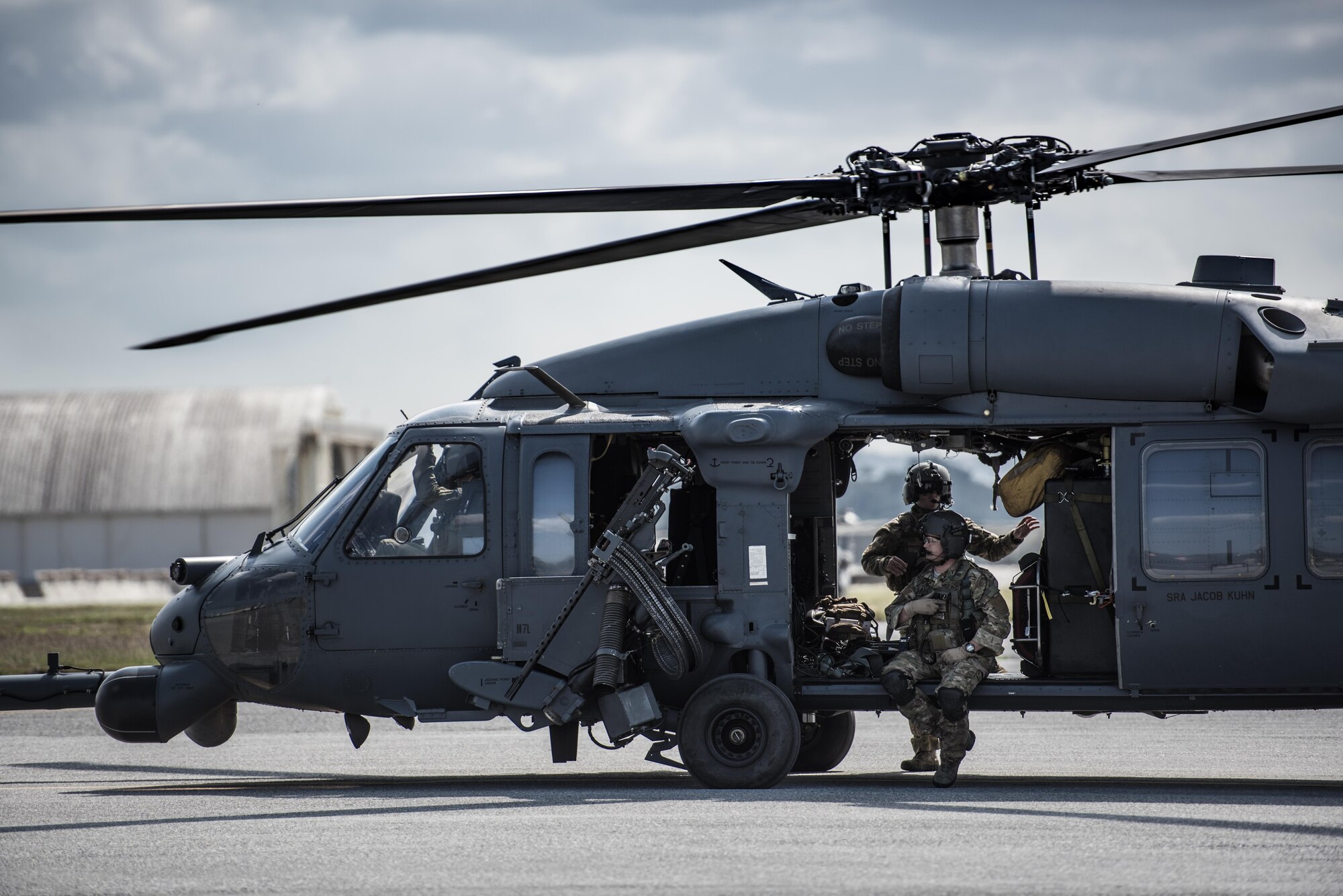 An HH-60 Pavehawk crew from the 33rd Rescue Squadron awaits take off from the flightline March 7, 2017, at Kadena Air Base, Japan. Members of the 33rd and 31st Rescue Squadrons train and work together to provide support for combat rescue and disaster relief. (U.S. Air Force photo by Senior Airman Omari Bernard)