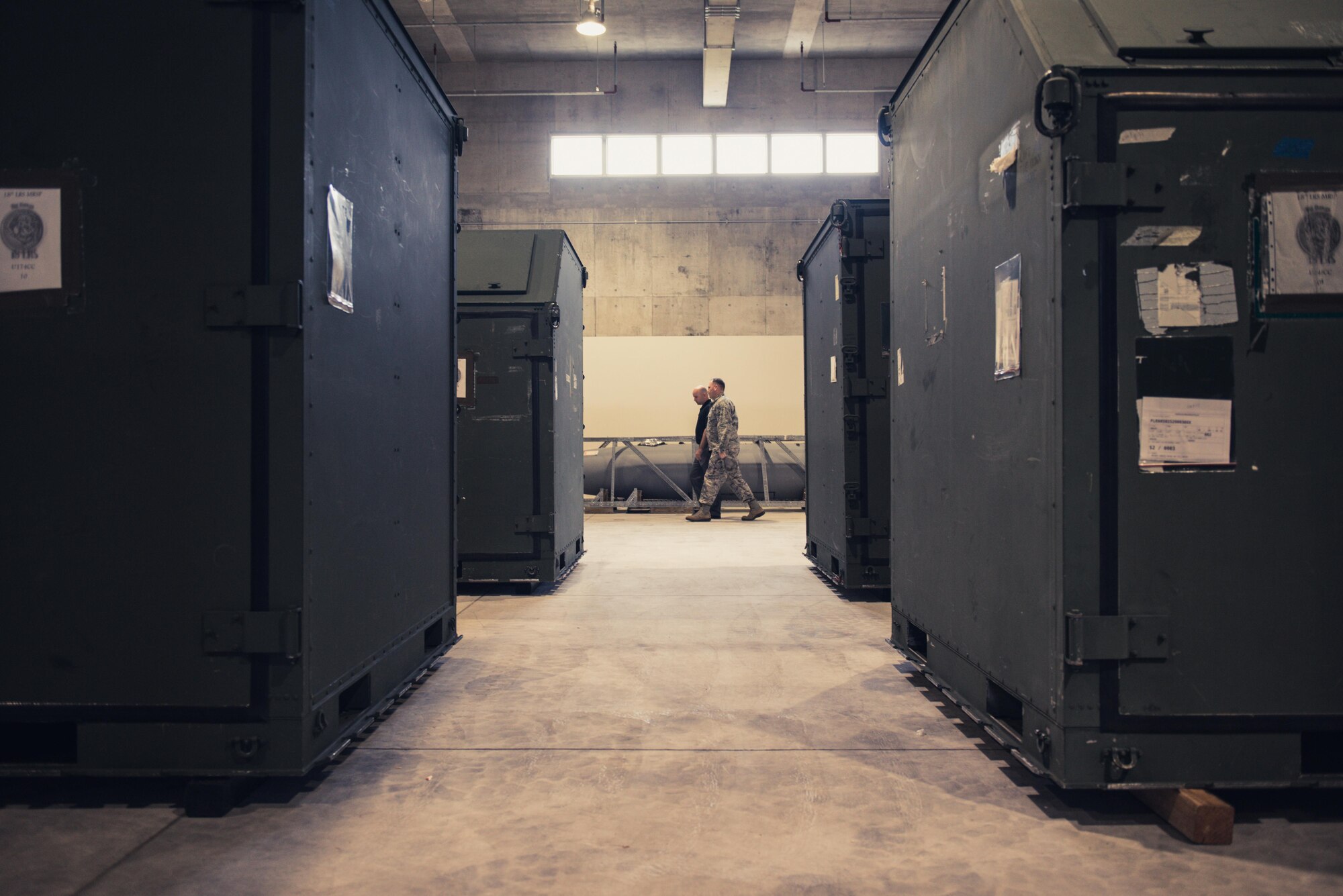 Col. Kieran Keelty, 18th Mission Support Group commander, walks through a new Logistics Readiness Squadron building March 13, 2017, at Kadena Air Base, Japan. The facilities can contain tools, supplies and other materials necessary for the mission of the 18th Wing. (U.S. Air Force photo by Senior Airman Omari Bernard)