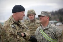 LTG Charles Luckey, left, Commanding General, U.S. Army Reserve, briefly meets with Sgt. 1st Class Joseph Mah, one of a few Master Gunners in the Army Reserve, during Operation Cold Steel in a second visit to the exercise at Fort McCoy, Wisconsin, Mar. 18, 2017. According to the U.S. Army Training and Doctrine Command News Center, a master gunner is a technical and tactical expert and advisor to the commander and advises the commander on anything related to the vehicle platform or weapons system and helps develop all the materials necessary to conduct gunnery and live fire exercises. Operation Cold Steel is the U.S. Army Reserve’s crew-served weapons qualification and validation exercise to ensure that America’s Army Reserve units and Soldiers are trained and ready to deploy on short-notice and bring combat-ready and lethal firepower in support of the Army and joint partners anywhere in the world. 475 crews with an estimated 1,600 Army Reserve Soldiers will certify in M2, M19 and M240 Bravo gunner platforms.
(U.S. Army Reserve photo by Master Sgt. Anthony L. Taylor)