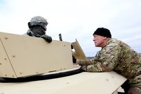 LTG Charles Luckey, Commanding General, U.S. Army Reserve, meets Spc. Dalan Benson, assigned to the 560th Movement Control Team, Springfield, Missouri, before a gunnery qualification lane during the Operation Cold Steel exercise at Fort McCoy, Wisconsin, Mar. 18, 2017. Operation Cold Steel is the U.S. Army Reserve’s first large-scale live-fire training and crew-served weapons qualification and validation exercise to ensure that America’s Army Reserve units and Soldiers are trained and ready to deploy on short-notice and bring combat-ready and lethal firepower in support of the Army and joint partners anywhere in the world. 475 crews with an estimated 1,600 Army Reserve Soldiers will certify in M2, M19 and M240 Bravo gunner platforms. 
(U.S. Army Reserve photo by Master Sgt. Anthony L. Taylor)
