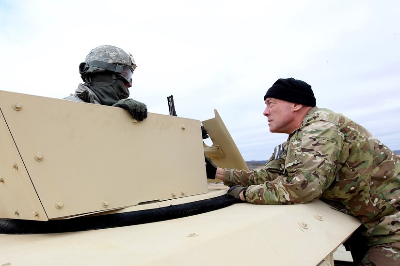 LTG Charles Luckey, Commanding General, U.S. Army Reserve, meets Spc. Dalan Benson, assigned to the 560th Movement Control Team, Springfield, Missouri, before a gunnery qualification lane during the Operation Cold Steel exercise at Fort McCoy, Wisconsin, Mar. 18, 2017. Operation Cold Steel is the U.S. Army Reserve’s first large-scale live-fire training and crew-served weapons qualification and validation exercise to ensure that America’s Army Reserve units and Soldiers are trained and ready to deploy on short-notice and bring combat-ready and lethal firepower in support of the Army and joint partners anywhere in the world. 475 crews with an estimated 1,600 Army Reserve Soldiers will certify in M2, M19 and M240 Bravo gunner platforms. 
(U.S. Army Reserve photo by Master Sgt. Anthony L. Taylor)