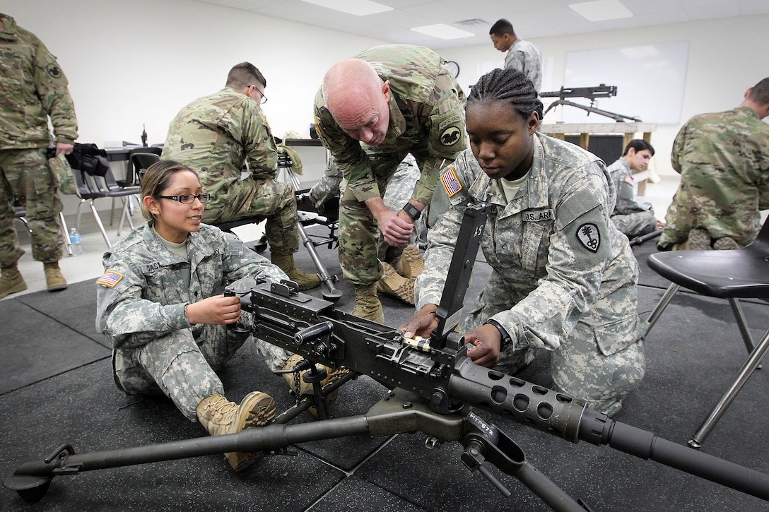 LTG Charles Luckey, Commanding General, U.S. Army Reserve, meets Spc. Vanessa Castro, left, and Pvt. 1st Class Ariana McHerron both assigned to the 822nd Military Police Company, Arlington Heights, Illinois, during training with the M2 machine gun at the Operation Cold Steel exercise at Fort McCoy, Wisconsin, Mar. 18, 2017. Operation Cold Steel is the U.S. Army Reserve’s first large-scale live-fire training and crew-served weapons qualification and validation exercise to ensure that America’s Army Reserve units and Soldiers are trained and ready to deploy on short-notice and bring combat-ready and lethal firepower in support of the Army and joint partners anywhere in the world. 475 crews with an estimated 1,600 Army Reserve Soldiers will certify in M2, M19 and M240 Bravo gunner platforms. 
(U.S. Army Reserve photo by Master Sgt. Anthony L. Taylor)