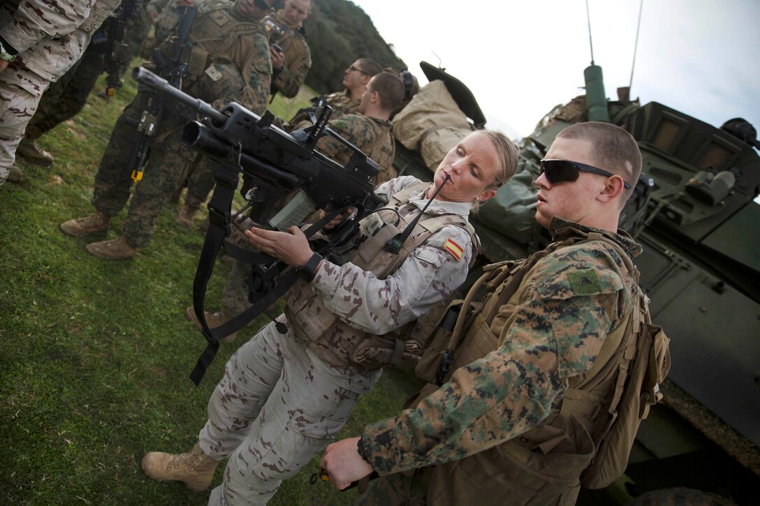 A Spanish marine, left, explains how her weapon works to a U.S. Marine during the Spanish Bilateral Amphibious Landing Exercise in Sierra del Retin, Spain, March 13, 2017. Marine Corps photo by Cpl. Autmn Bobby