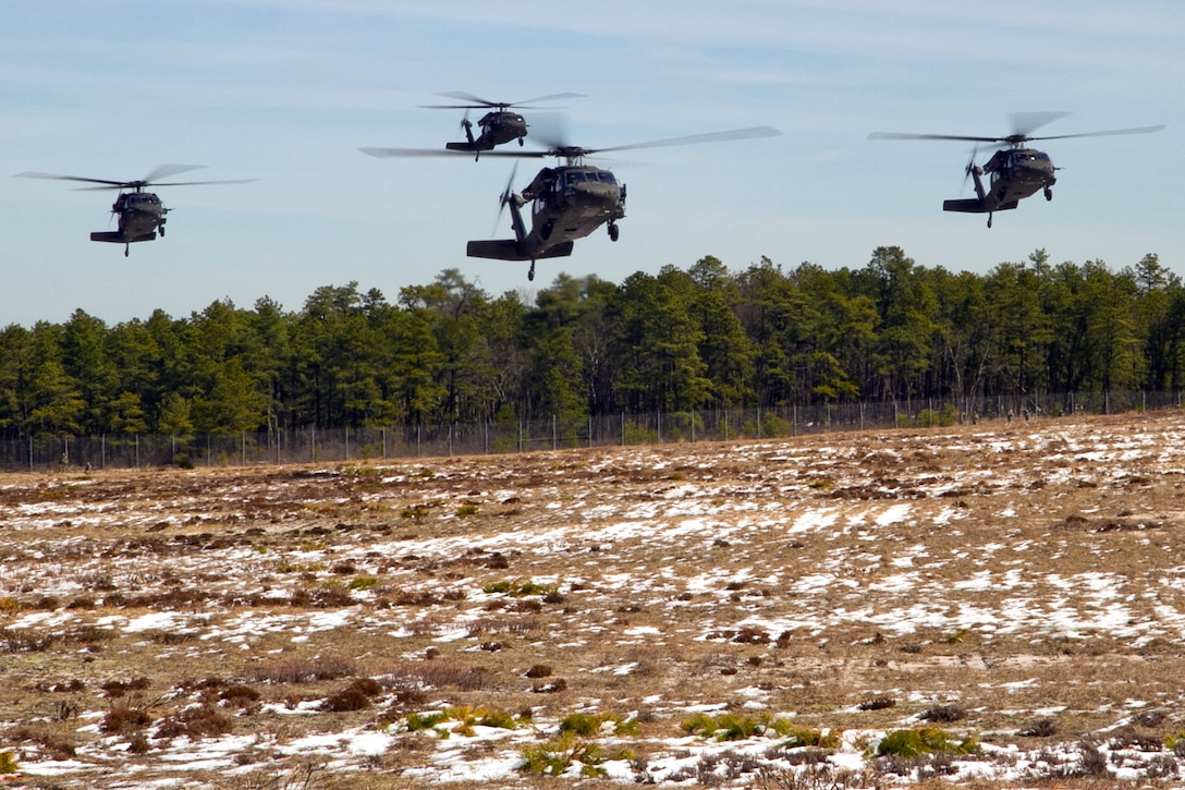 Four UH-60 Black Hawk helicopters prepare to land during a multi-component airfield seizure training exercise, part of Warrior Exercise 78-17-01, at Joint Base McGuire-Dix-Lakehurst, N.J., March 13, 2017. The helicopter crews are assigned to the Army Reserve's 8th Battalion, 229th Aviation Regiment, deployed from Fort Knox, Ky. Soldiers assigned to the 101st Airborne Division (Air Assault), acted as the opposing force during the training. Army Reserve photo by Master Sgt. Mark Bell