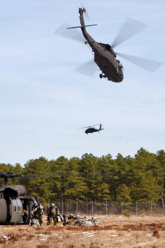 Soldiers provide perimeter security after exiting UH-60 Black Hawk helicopters during a multi-component airfield seizure training exercise, part of Warrior Exercise 78-17-01, at Joint Base McGuire-Dix-Lakehurst, N.J., March 13, 2017. Army Reserve photo by Master Sgt. Mark Bell