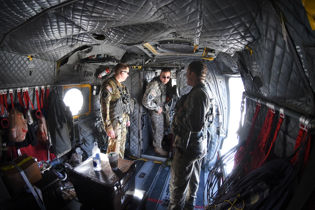 South Carolina Army National Guardsmen discus their flight mission and safety brief before conducting high-altitude flight operations near Vail, Colo., March 10, 2017. Army National Guard photo by Staff Sgt. Roberto Di Giovine
