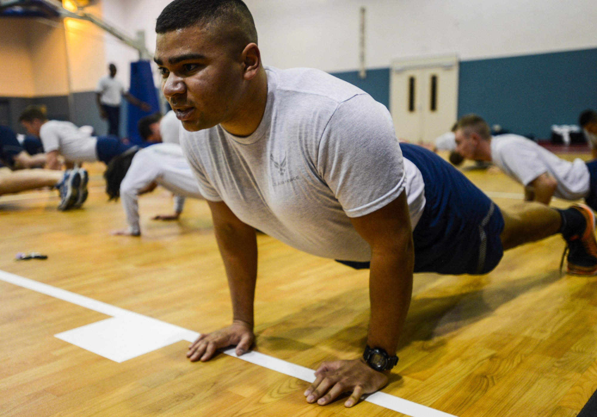 Airman 1st Class Matthew Murray, 1st Air and Space Communications Operations Squadron intelligence network infrastructure technician, performs a pushup during a unit physical training session on Ramstein Air Base, Germany, March 14, 2017. As the 1 ACOS tries to complete 435,000 pushups by June 2018, the unit counts pushups that are performed during PT sessions, physical fitness assessments, and random pushups as long as another Airmen is present to verify the number done. (U.S. Air Force photo/Staff Sgt. Timothy Moore)