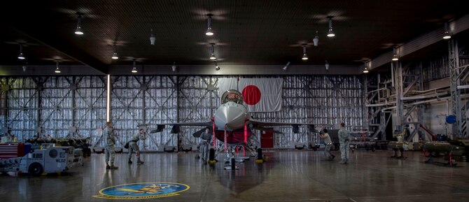 U.S. Air Force Senior Airman Aaron Paul Colbert, left, and Senior Airman Jacob D. Jennings, right, both 35th Maintenance Group weapons evaluators, assess crew 15’s loading capacities in the load barn at Misawa Air Base, Japan, Feb. 28, 2017. Misawa remains engaged in the commitment to preserve the security, stability and prosperity in the Indo-Asia-Pacific region, through actions such as ensuring its weapons crews are ready to deploy at a moment's notice. (U.S. Air Force photo by Tech. Sgt. Araceli Alarcon)