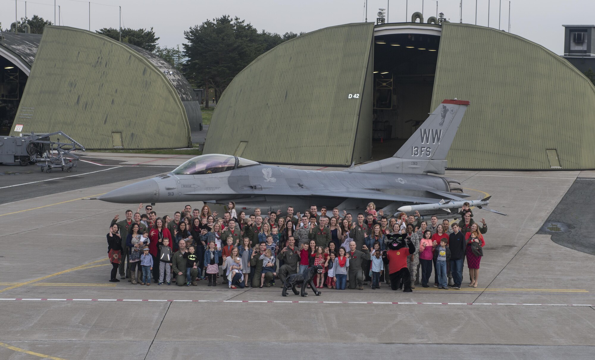 13th Fighter Squadron Airmen and their familiies pose for a photo at Misawa Air Base, Japan, May 6, 2016. Misawa is home to the 13th and 14th Fighter Squadrons which fly the Wild Weasel mission. (U.S. Air Force Courtesy Photo)