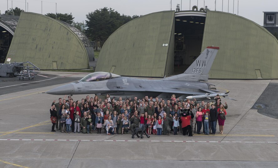 13th Fighter Squadron Airmen and their familiies pose for a photo at Misawa Air Base, Japan, May 6, 2016. Misawa is home to the 13th and 14th Fighter Squadrons which fly the Wild Weasel mission. (U.S. Air Force Courtesy Photo)
