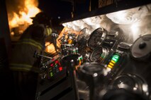 The pump panel of a fire engine is illuminated by lights at Misawa Air Base, Japan, March 15, 2017. The series of levers and switches control water flow and which lines are being discharged. The hoses connect to firetrucks, which hold up to 3,000 gallons of water per truck. (U.S. Air Force photo by Staff Sgt. Melanie A. Hutto)