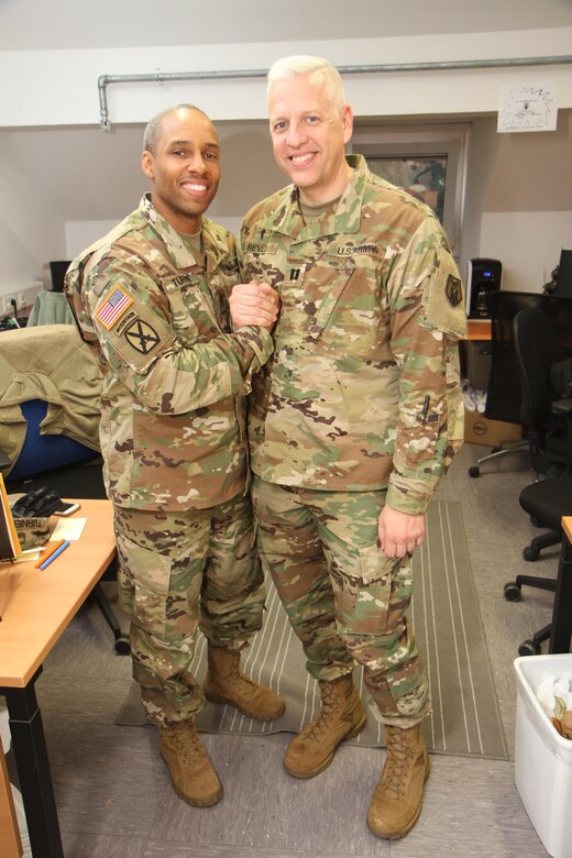 Staff Sgt. Lamar Turner, chaplain’s assistant, left, and  
Capt. Matthew P. Reves commander, both from the 89th Chaplain Detachment, 7th Mission Support Command pose for a photo March 19, 2017 as they prepare for deployment.  
