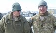 Sgt. 1st Class John Wessely and Sgt. 1st Class Mark Korte both with Company D, 457th Civil Affairs Battalion, 7th Mission Support Command, stand next to each other in Afghanistan after their promotion to Staff Sergeant in March 2013.  